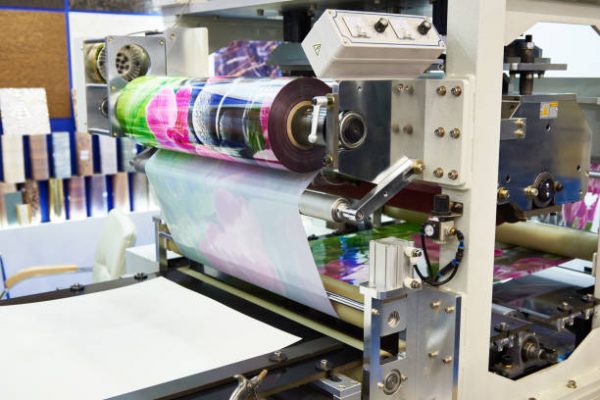 Machine for making plastic films with color prints